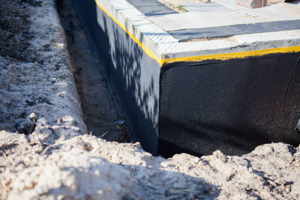 Professional Basement Waterproofing technician working in Laketon, IN